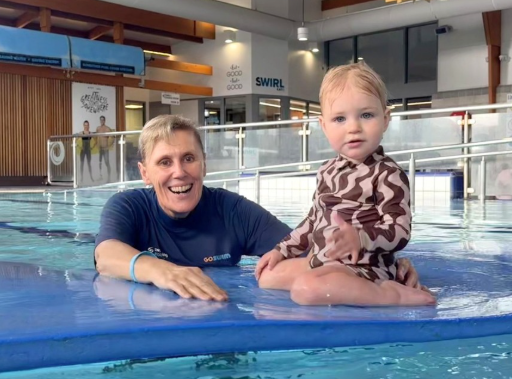 Karen teaching a lesson with baby